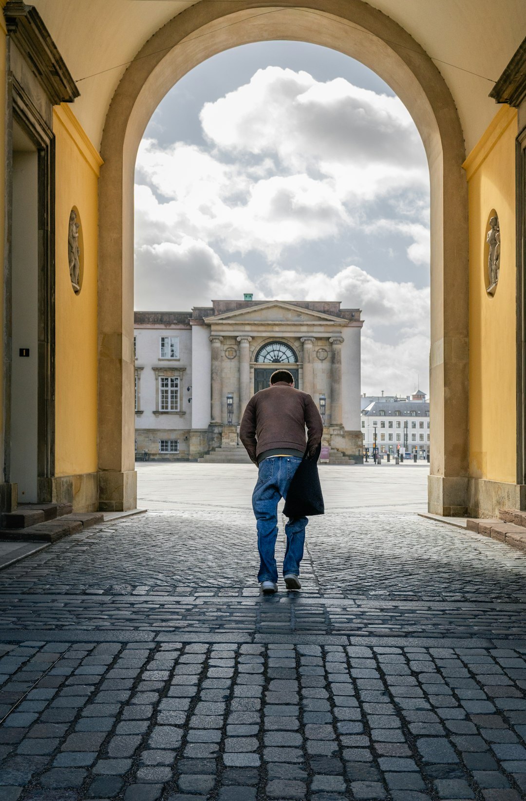 Danish child playing in a cobblestone street