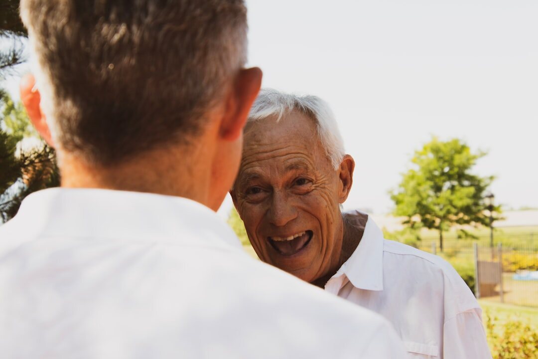 elderly person helping neighbor